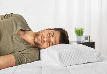 man uses sharper image snore pillow