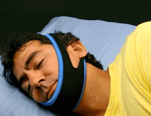 man wearing chin strap for snoring