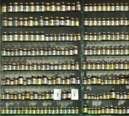 Glass bottles of vitamins on shelves