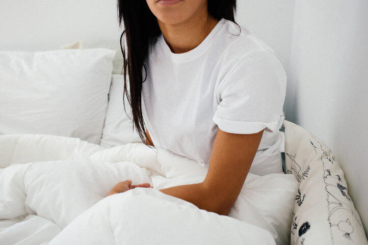 lady sitting up in bed