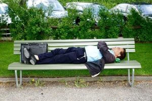 business man laying on bench business man laying on bench