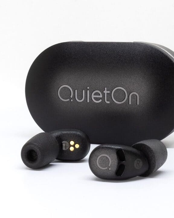 QuietOn 4 sleep earbuds beside their charging case