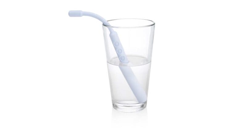 Dream Sipper silicone tongue trainer straw standing in a glass of water