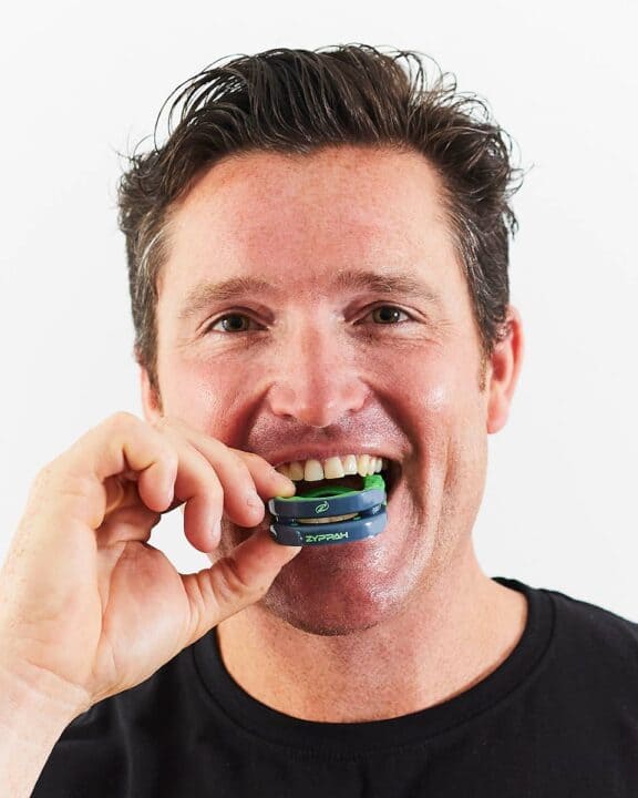 Man biting into a Zyppah mouthpiece to mould it to his teeth